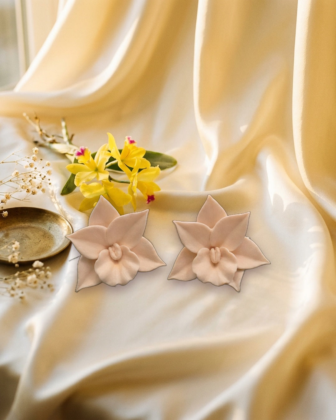 Blush cream Cattleya orchid polymer clay stud earrings on champagne silk