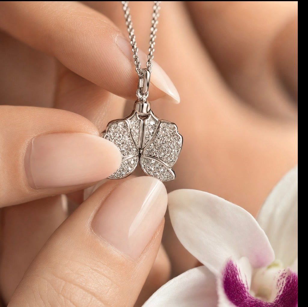 White Gold Dendrobium orchid locket necklace with pave petals and secret message engraving