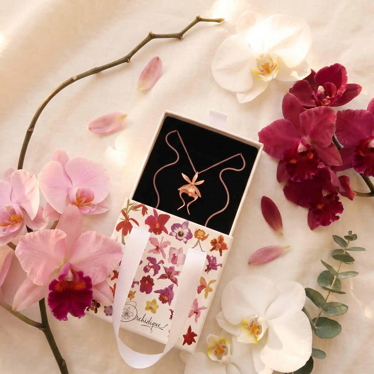 Ghost Orchid Rose Gold Pendant Necklace on Moss & White Orchids - Orchidique