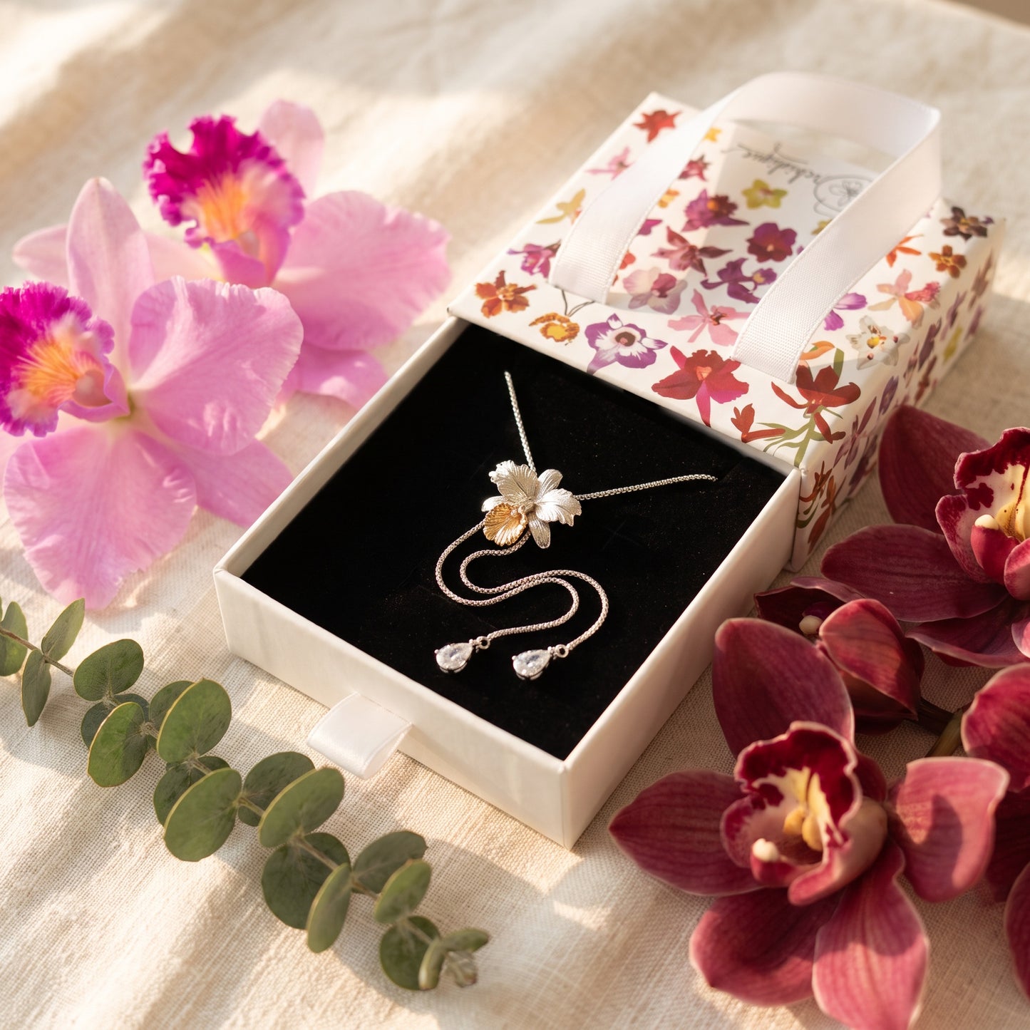 Drama Cattleya Dowiana Lariat Necklace on Moss & White Cattleyas - Orchidique