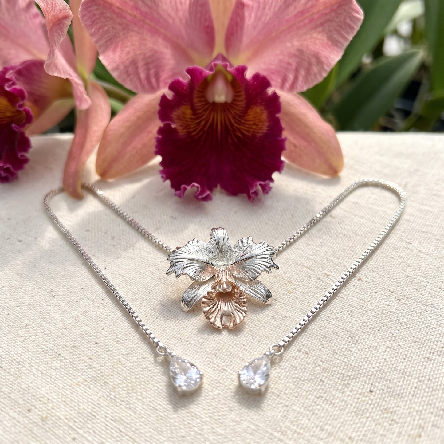 Drama Cattleya Dowiana Lariat Necklace on White Marble - Orchidique