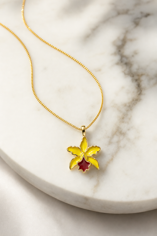 La Colombiana Collection Yellow & Red Cattleya Orchid Necklace on white marble - Orchidique
