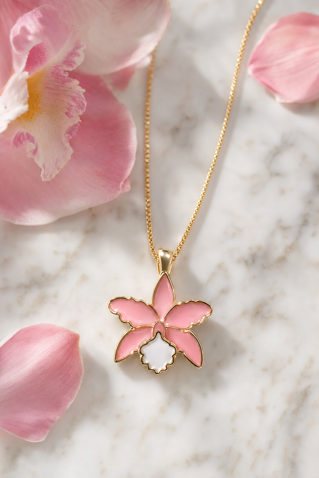 La Colombiana Collection Soft Pink & White Cattleya Orchid Necklace on marble with petals - Orchidique