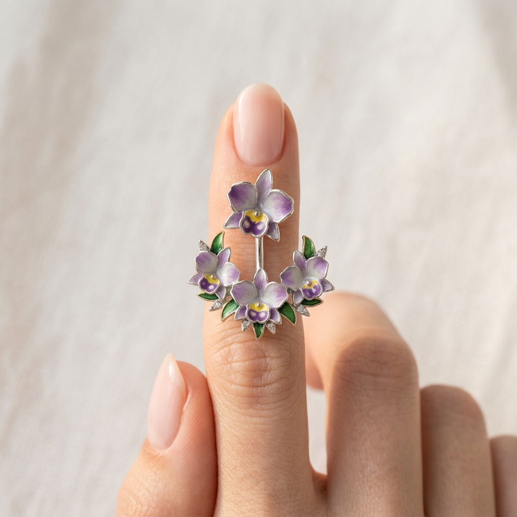 cattleya orchid stud earrings, lavender enamel, 14K gold plated sterling silver, held on finger close-up – Orchidique