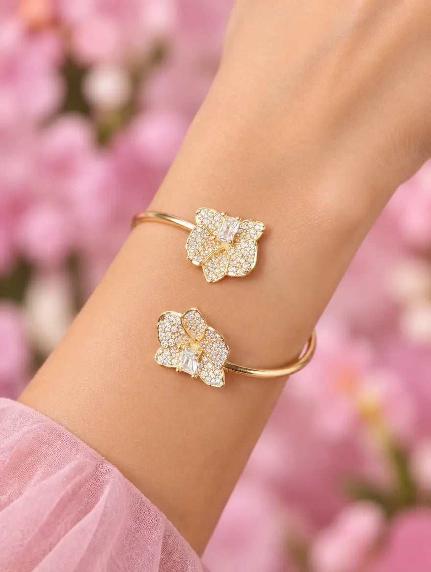 dendrobium orchid bangle, shimmer, clear, 14K gold plated sterling silver, worn on wrist, bangle front – Orchidique