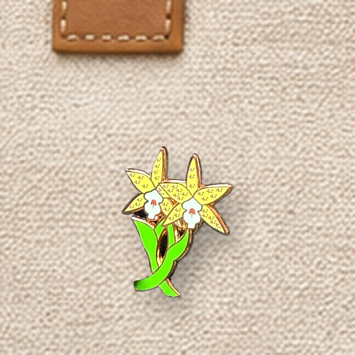 Double Laelia Cattleya enamel pin close-up on canvas tote