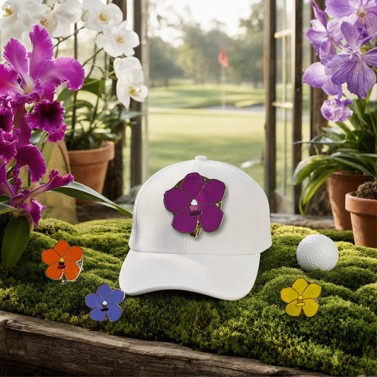 Vanda Orchid golf hat charm on a white golf cap in a moss greenhouse overlooking the golf course