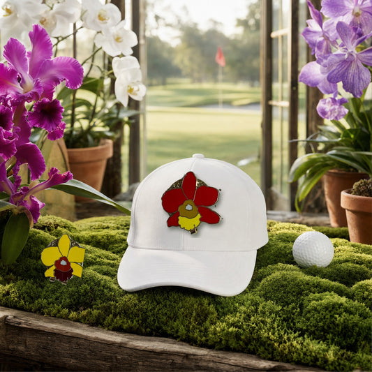 Cattleya Orchid golf hat charm on a white golf cap in a moss greenhouse overlooking the golf course