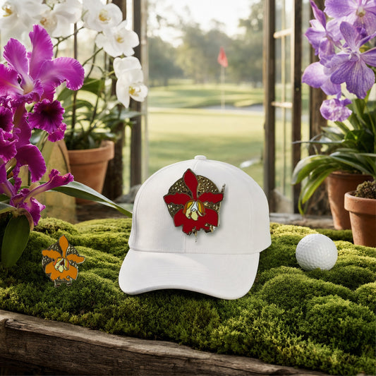 Schomburgkia Orchid golf hat charm on a white golf cap in a moss greenhouse overlooking the golf course