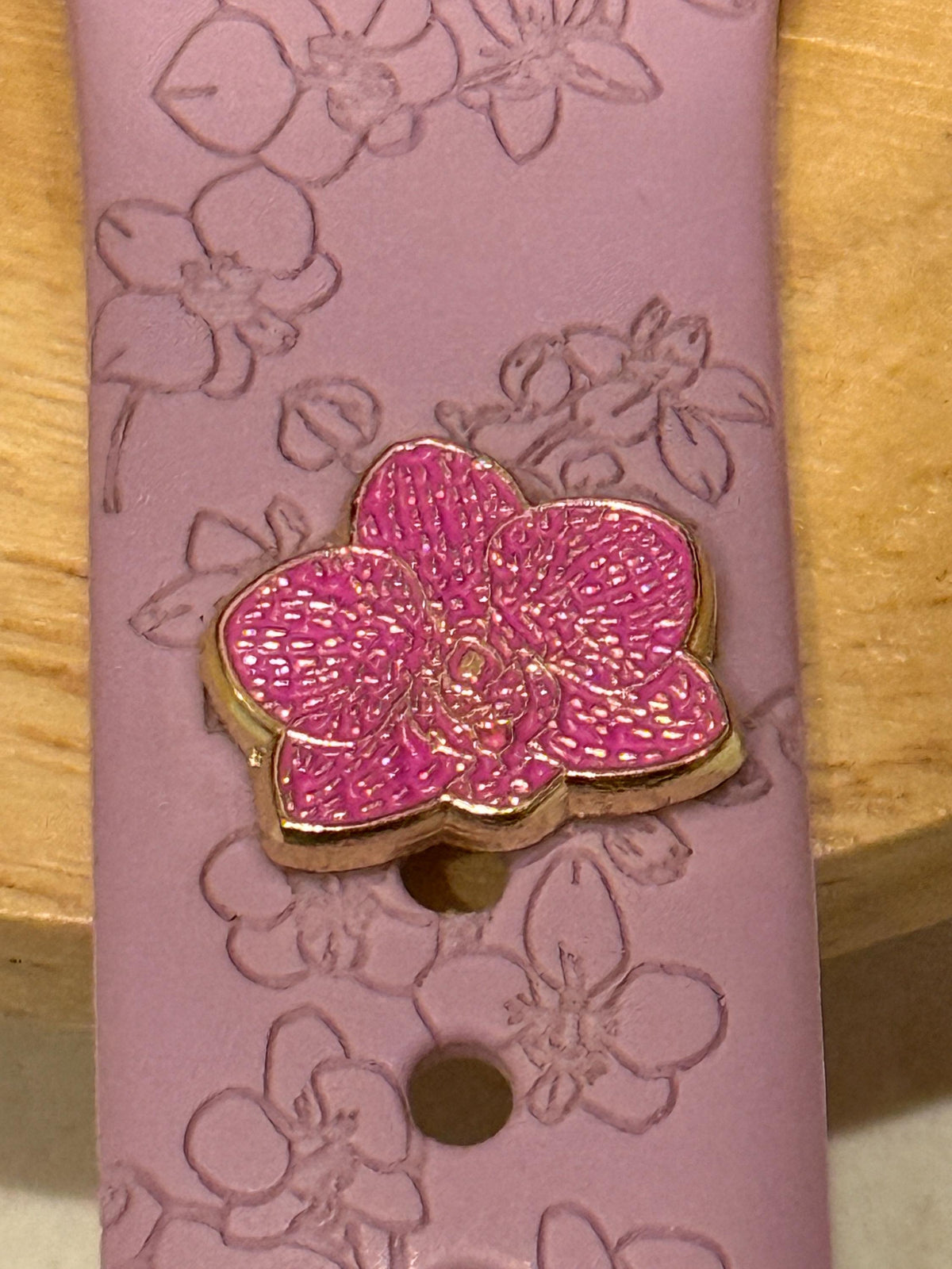 Pink engraved watch band with a pink Phalaenopsis charm