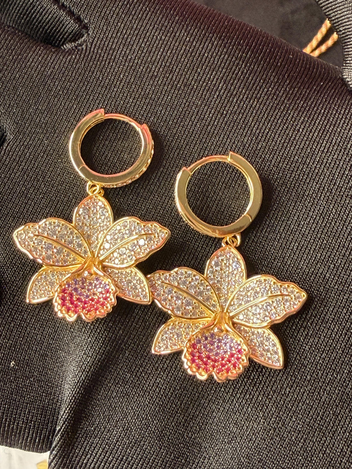cattleya orchid hoop earrings, 14K gold plated sterling silver, pair on gloved hand – Orchidique
