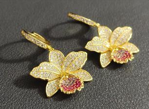cattleya orchid hoop earrings, 14K gold plated sterling silver, pair on dark fabric – Orchidique