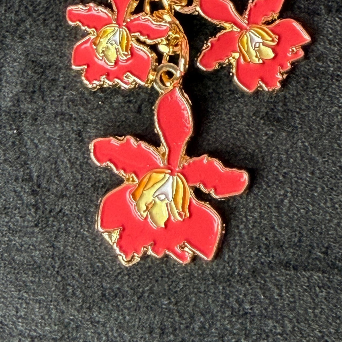 myrmecophila orchid bag charm, red enamel, zinc alloy, product view – Orchidique