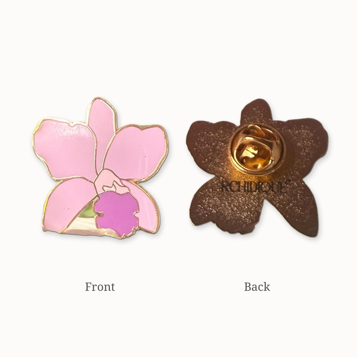 Lueddemannia orchid enamel pin front and back, glitter back with ORCHIDIQUE stamp and gold-tone butterfly clutch