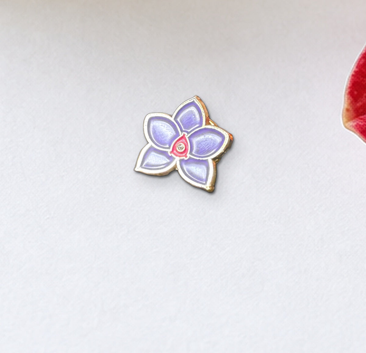 Close-up of the Purple mini novelty Phalaenopsis enamel pin with gold-tone outline