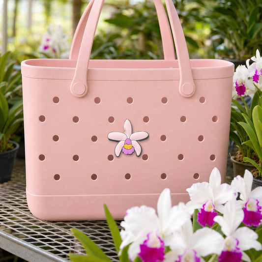 Signature Cattleya White Bag Charm, PVC orchid tote bag charm shown in use at true size, Orchidique