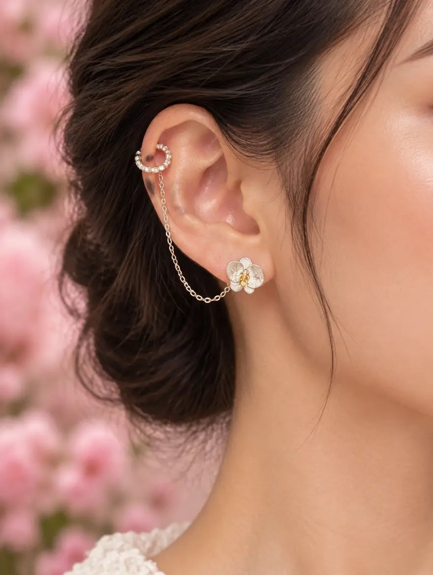 phalaenopsis orchid chain cuff, sterling silver, worn on model, front angle – Orchidique