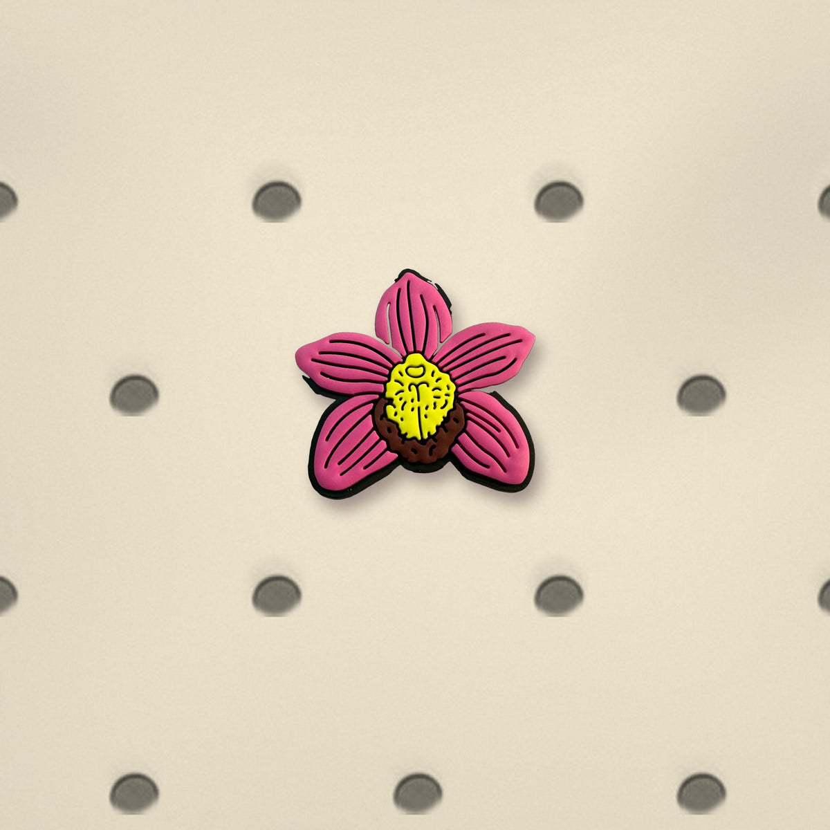 Pink Cymbidium orchid PVC tote bag charm close-up on cream bag